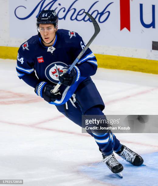 Logan Stanley of the Winnipeg Jets skates during third period action against the New Jersey Devils at Canada Life Centre on November 14, 2023 in...