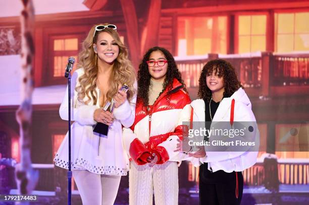 Mariah Carey accepts the Billboard Chart Achievement Award for "All I Want For Christmas Is You" alongside her children, Monroe Cannon and Moroccan...