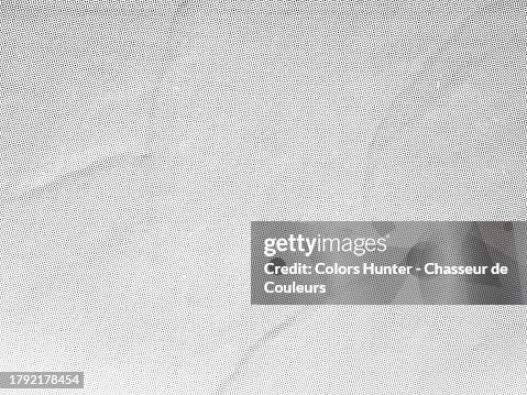 Close-up of a white poster with a mesh of black and grey dots pasted onto a textured wall in Paris, France Close-up of a white poster with a mesh of black and grey dots pasted onto a textured wall in Paris, France