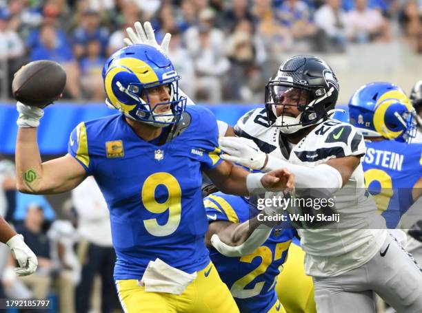 Inglewood, CA Los Angeles Rams' Matthew Stafford is pressured by Seattle Seahawks' Julian Love during game action at SoFi Stadium on Sunday, Nov. 19...