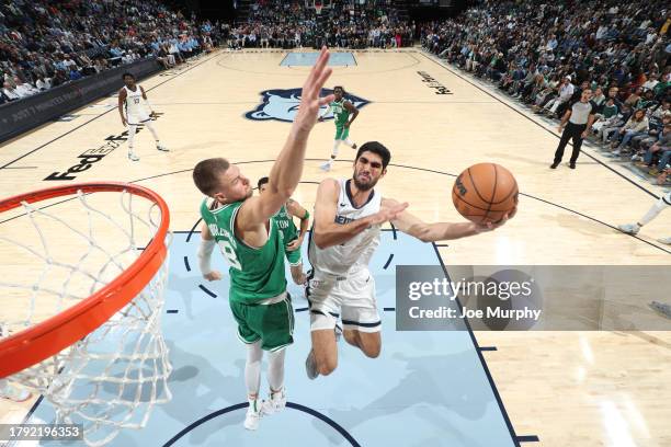 Santi Aldama of the Memphis Grizzlies drives to the basket during the game against the Boston Celtics on November 19, 2023 at FedExForum in Memphis,...