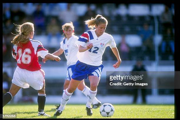 Carin Gabarra of the USA and Dorthe Larsen of Norway run down the field during an Algarve Cup game. Mandatory Credit: Allsport /Allsport
