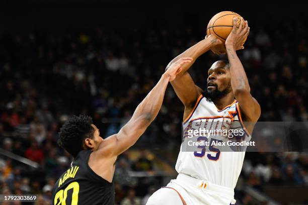 Kevin Durant of the Phoenix Suns shoots the ball against Ochai Agbaji of the Utah Jazz during the second half of a game at Delta Center on November...