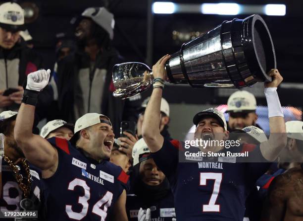 Montreal Alouettes quarterback Cody Fajardo raises the Grey Cup as the Montreal Alouettes beat the Winnipeg Blue Bombers 28-24 in the 110th edition...