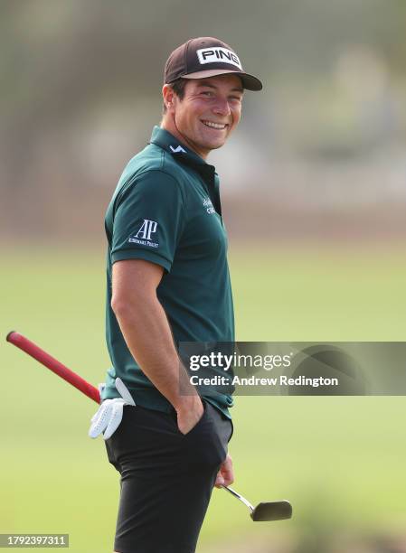 Viktor Hovland of Norway smiles on the 18th hole during the Pro-Am prior to the DP World Tour Championship on the Earth Course at Jumeirah Golf...