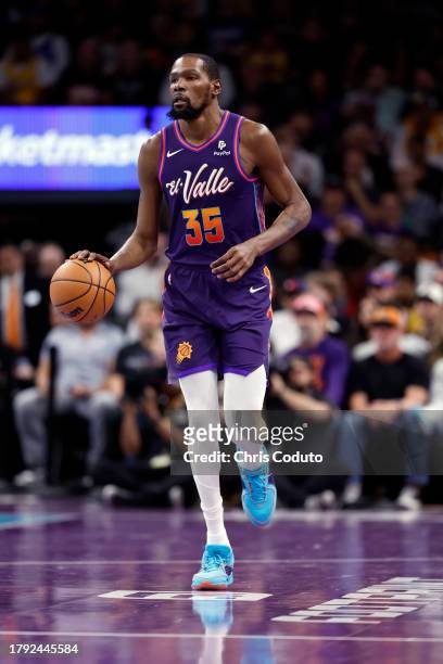 Kevin Durant of the Phoenix Suns dribbles the ball during the first half of the In-Season Tournament game against the Los Angeles Lakers at Footprint...