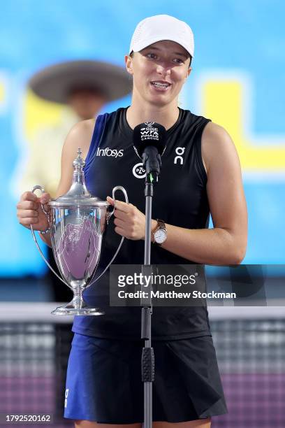Iga Swiatek of Poland addresses the audiance at the trophy ceremony after defeating Jessica Pegula of the United States in the singles final on the...