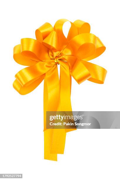 gold color bow is isolated on a white background. clipping path - bow tie stock pictures, royalty-free photos & images