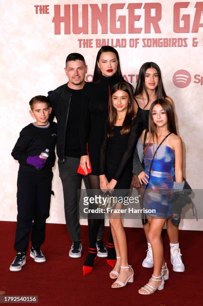 Andre Lemmers, Adriana Lima and family attend "The Hunger Games: The Ballad of Songbirds & Snakes" Los Angeles Premiere at TCL Chinese Theatre on...