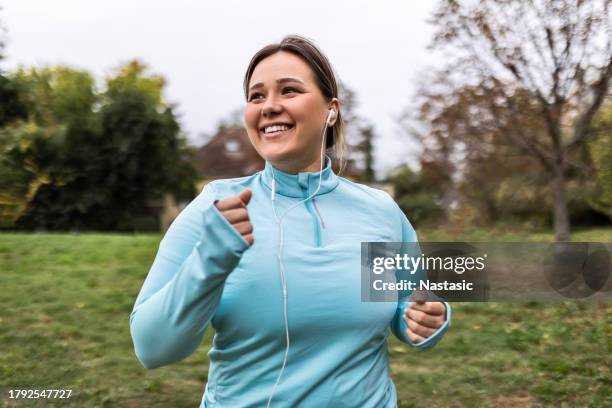 woman finding joy in every step - fitness dieting stock pictures, royalty-free photos & images