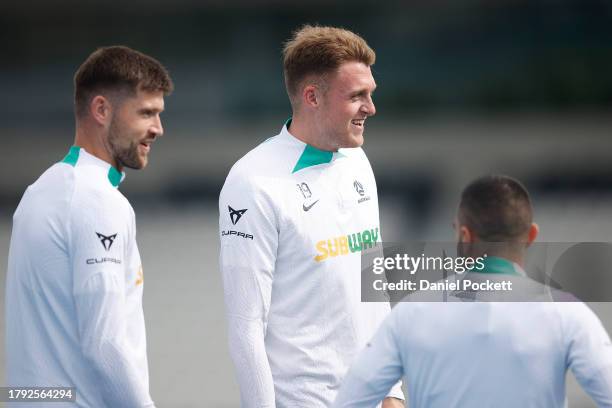 Harry Souttar of the Socceroos shares a laugh with teammates during a Socceroos training session at Lakeside Stadium on November 14, 2023 in...