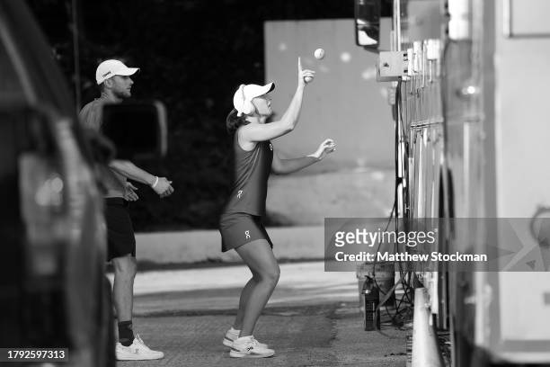 This image has been converted to black and white Iga Swiatek of Poland warms-up prior to playing Jessica Pegula of the United States in the singles...