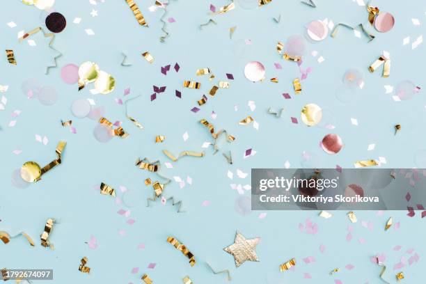 colored confetti flying on blue background - congratulations script stock pictures, royalty-free photos & images
