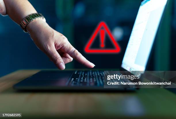 hacker or programmer hand using laptop - computer virus stockfoto's en -beelden