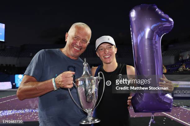 Iga Swiatek of Poland poses with her father Tomasz Swiatek after defeating Jessica Pegula of the United States in the singles final on the final day...