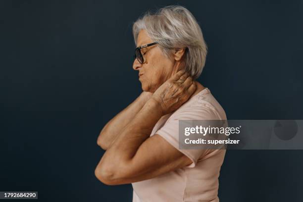 elegance in adversity - stijf stockfoto's en -beelden