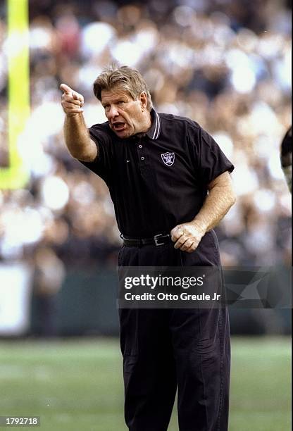 Head coach Joe Bugel of the Oakland Raiders gestures from the sidelines during a game against the Denver Broncos at the Oakland Alameda County...
