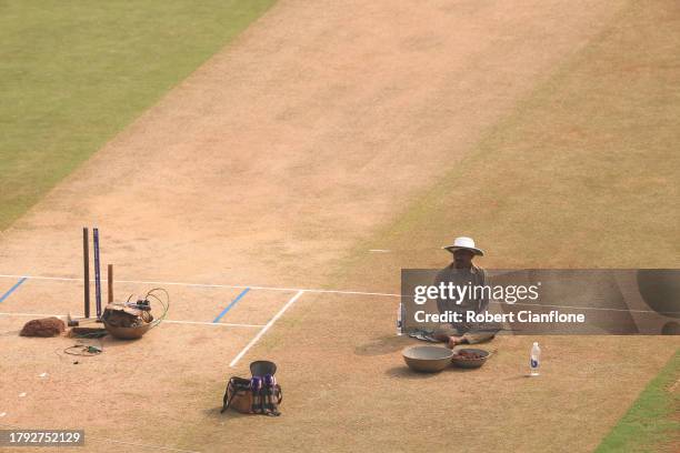 Grounds keeper takes a break during a New Zealand training session at the ICC Men's Cricket World Cup India 2023 at Wankhede Stadium on November 14,...