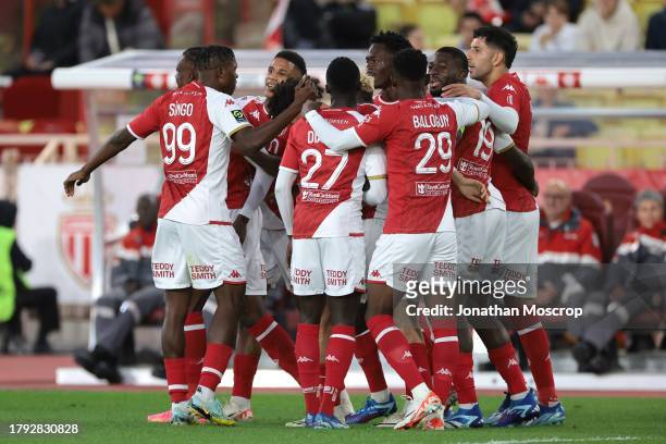 Denis Zakaria of AS Monaco celebrates with team mates after scoring to give the side a 1-0 lead during the Ligue 1 Uber Eats match between AS Monaco...