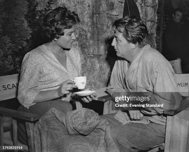 British actress Gia Scala and American actor Robert Mitchum during the filming of 'The Angry Hills' at MGM British Studios, Borehamwood,...