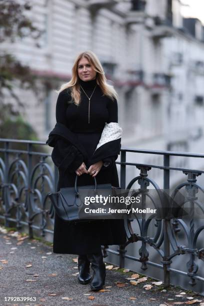 Britta Becker seen wearing TWELVE by Britta Becker black teddy long coat, TWELVE by Britta Becker high neck top, TWELVE by Britta Becker black...