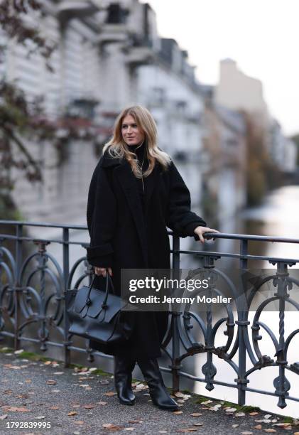 Britta Becker seen wearing TWELVE by Britta Becker black teddy long coat, TWELVE by Britta Becker high neck top, TWELVE by Britta Becker black...