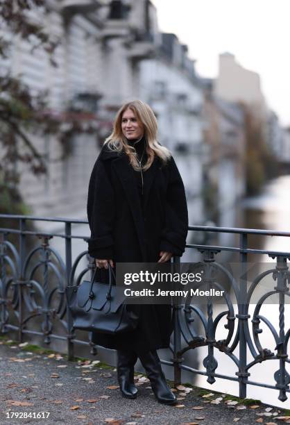 Britta Becker seen wearing TWELVE by Britta Becker black teddy long coat, TWELVE by Britta Becker high neck top, TWELVE by Britta Becker black...