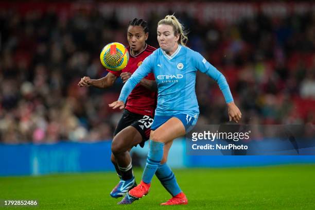 Lauren Hemp of Manchester City challenged by Geyse of Manchester United WFC during the Barclays FA Women's Super League match between Manchester...