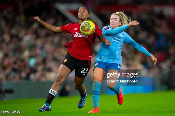 Lauren Hemp of Manchester City challenged by Geyse of Manchester United WFC during the Barclays FA Women's Super League match between Manchester...