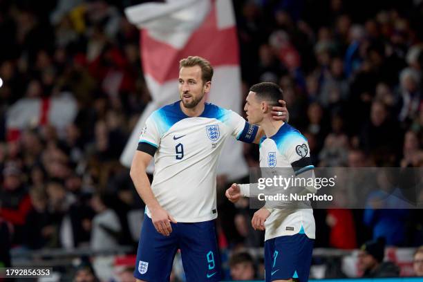 Harry Kane , captain of England congratulates team mate Phil Foden after England's 1-0 goal during the UEFA EURO 2024 group C qualification round...