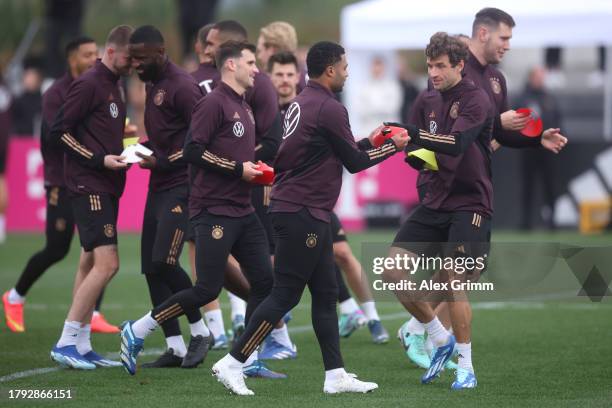 Thomas Mueller and Serge Gnabry interact during a training session of the German national team at DFB-Campus on November 14, 2023 in Frankfurt am...