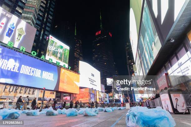 People put out plastic bags with sleeping bags, masks, blankets etc in preparation for a sleep out night on Times Square as part of Covenant House...