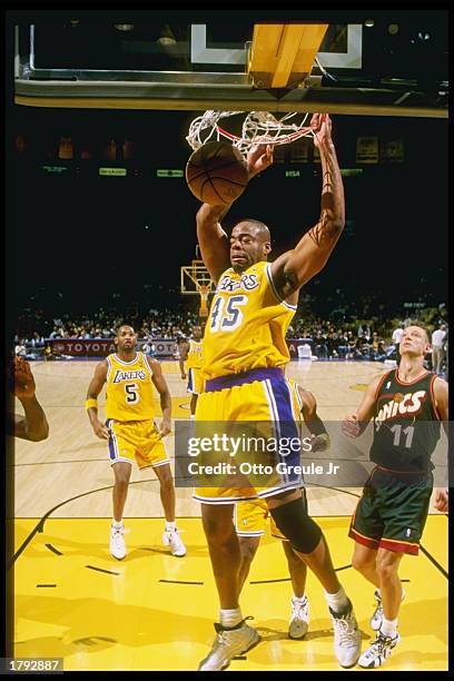 Laken Rooks Sean Rooks of the Los Angeles Lakers dunks the ball past the defense ...