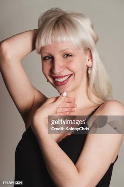 joyful transgender woman posing with confidence in lace top - guipuzco provincie stockfoto's en -beelden
