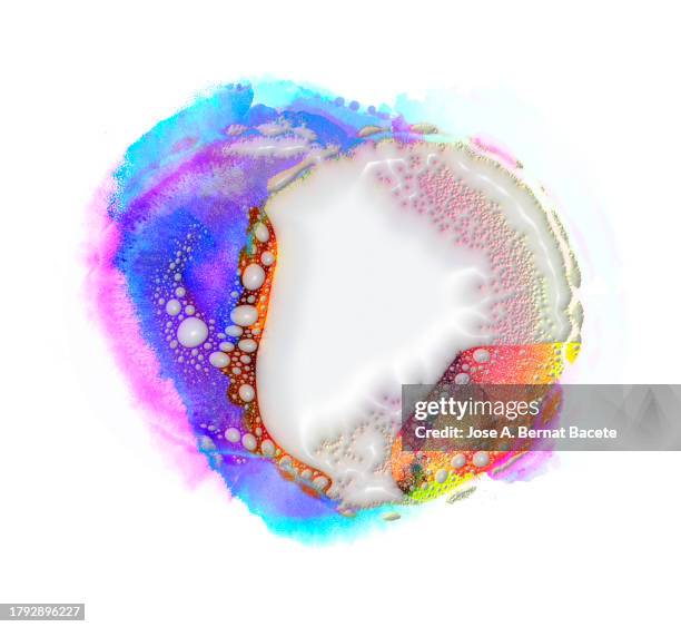 white paint and multicolor liquids mix. - membran stock-fotos und bilder