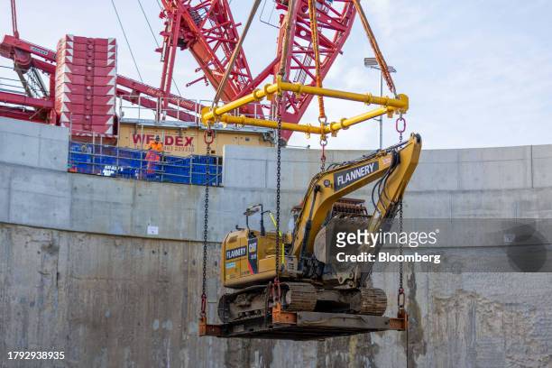 Crane removes an excavator from the HS2 Victoria Road Crossover Box of the High Speed Two HS2 Ltd. Railway development in London, UK, on Friday, Nov....