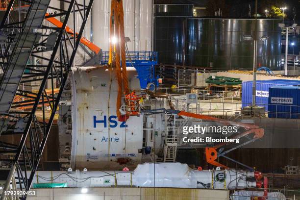 Workers prepare the middle shield of a tunnel boring machine for lifting into the HS2 Victoria Road Crossover Box construction of the High Speed Two...