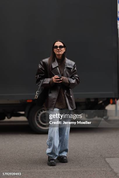 Anna Winter seen wearing Celine black sunglasses, By Aylin Koenig brown wool knit sweater / pullover, The Frankie Shop brown shiny leather crocodile...