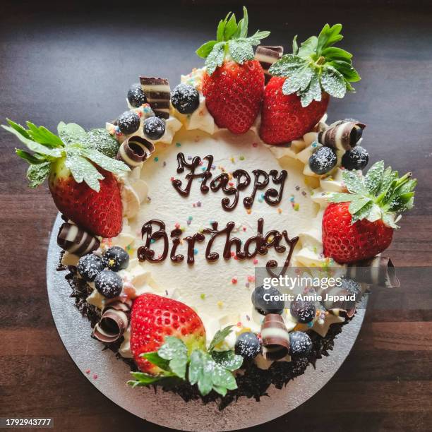 birthday cake with fresh strawberries for decoration, overhead table top view - birthday cake above stock pictures, royalty-free photos & images