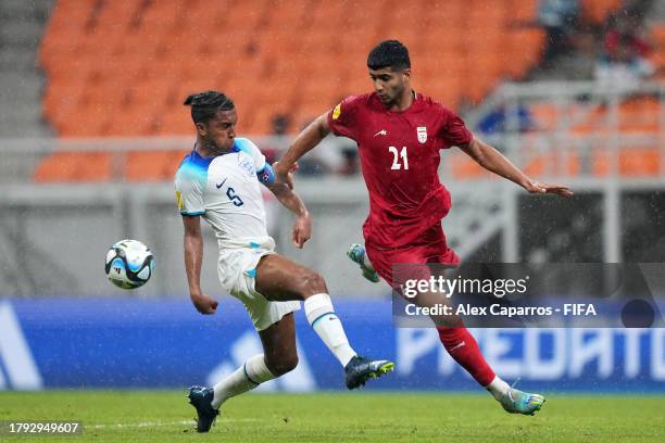 Lakyle Samuel of England battles for possession with Abolfazl Moredi of IR Iran during the FIFA U-17 World Cup Group C match between England and IR...