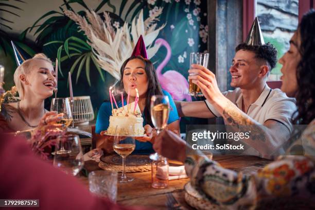 birthday girl blowing out candles - birthday candle stock pictures, royalty-free photos & images