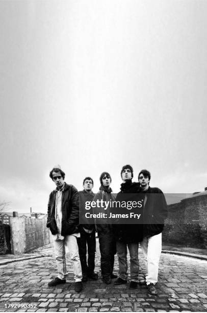 Group portrait of British rock band Oasis in Manchester, United Kingdom, 29th November 1993. L-R Paul Arthurs , Tony McCarroll, Liam Gallagher, Noel...