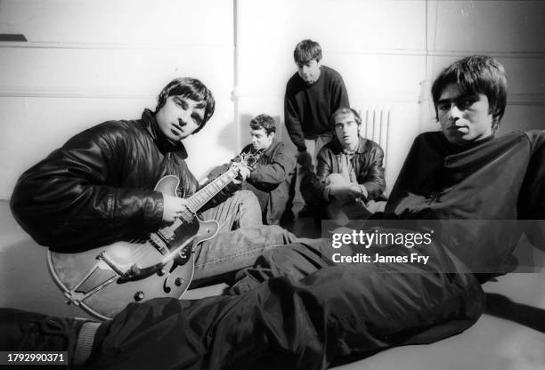 Group portrait of British rock band Oasis at Nomad Studios in Manchester, United Kingdom, 29th November 1993. L-R Noel Gallagher, Paul Arthurs , Paul...