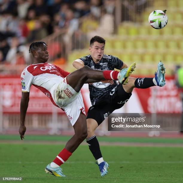 Wilfried Singo of AS Monaco anticipates Axel Camblan of Stade Brestois 29 to the ball during the Ligue 1 Uber Eats match between AS Monaco and Stade...
