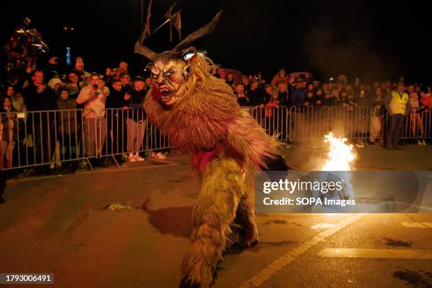 Krampus drags a fireball during a Krampus run. More than 600 Krampuses from Slovenia, Austria, Italy, and Croatia joined the tenth anniversary of the...