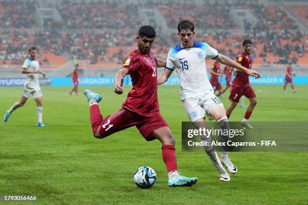 Abolfazl Moredi of IR Iran is challenged by Joe Johnson of England during the FIFA U-17 World Cup Group C match between England and IR Iran at...