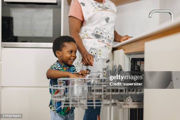 teamwork - small dishwasher stock pictures, royalty-free photos & images