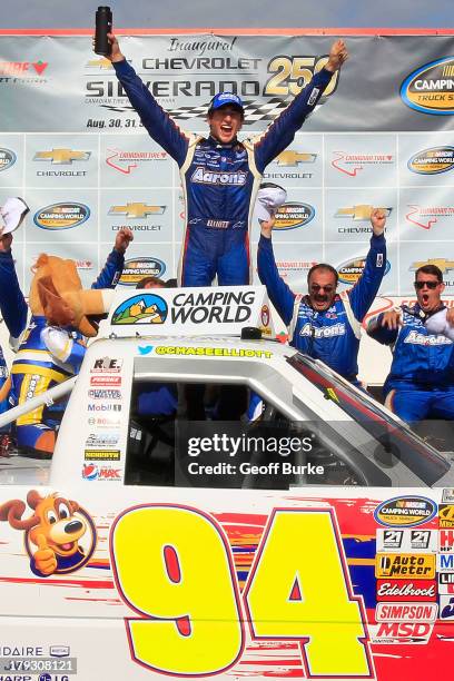 Chase Elliott, driver of the Aaron's Dream Machine/Hendrickcars.com Chevrolet, celebrates in victory lane after winning the NASCAR Camping World...