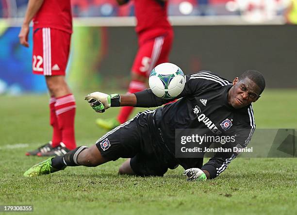 Sean Johnson of the Chicago Fire, angered by a goal scored in the 90th minute by the Houston Dynamo, knocks the ball back into the net during an MLS...