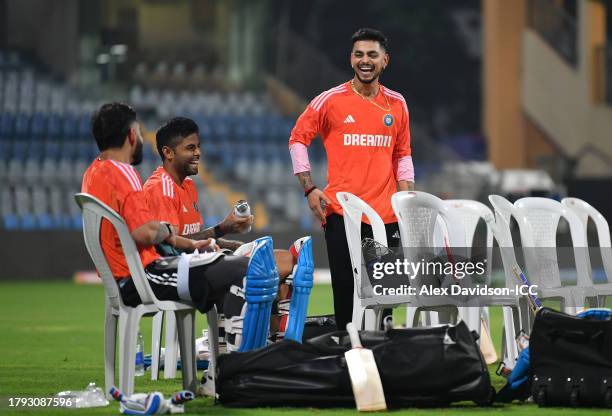 Virat Kohli, Suryajumar Yadav and Ishan Kishan of India interact during a India Nets Session ahead of the the ICC Men's Cricket World Cup India 2023...